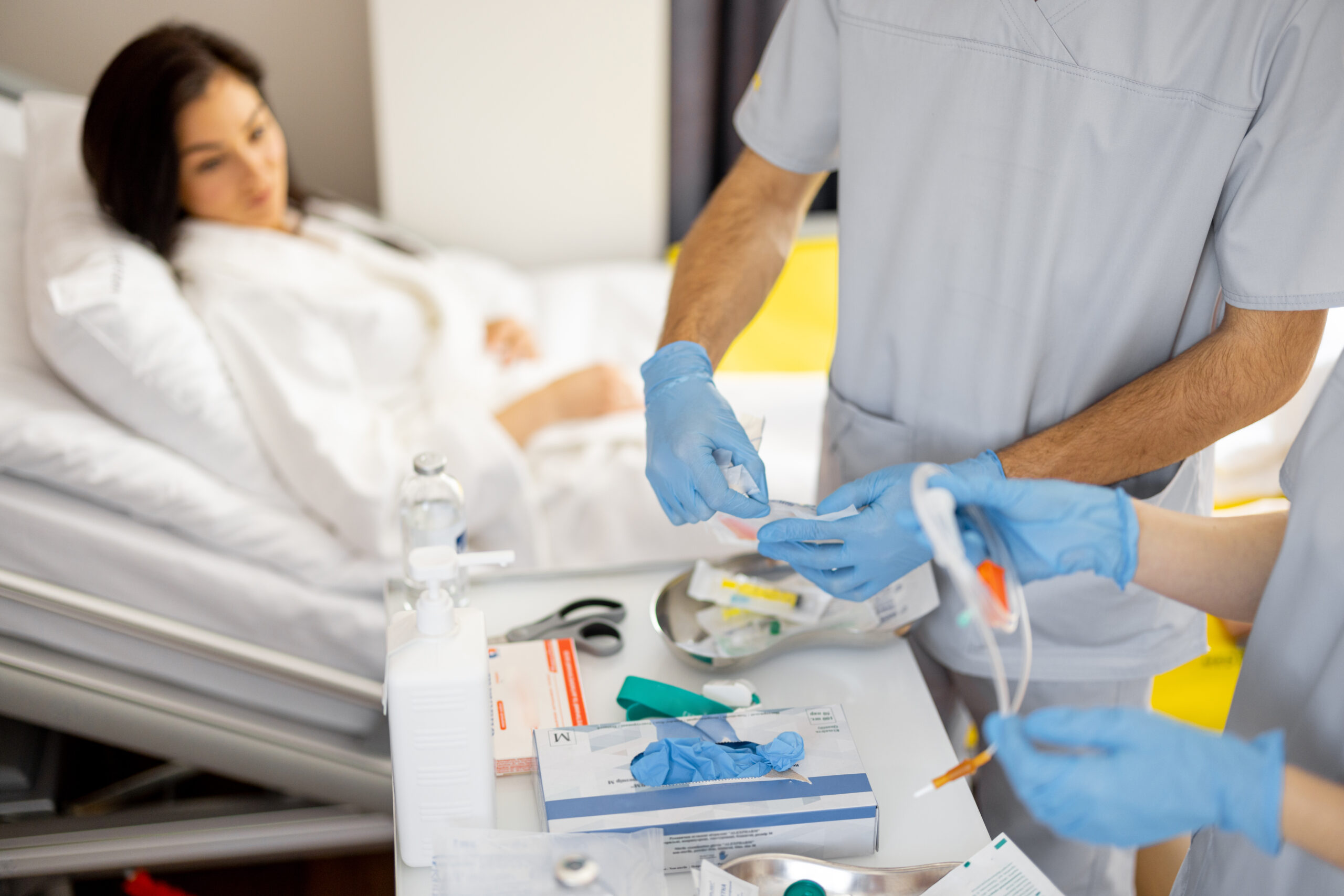 Nurses preparing for medical procedures in a ward